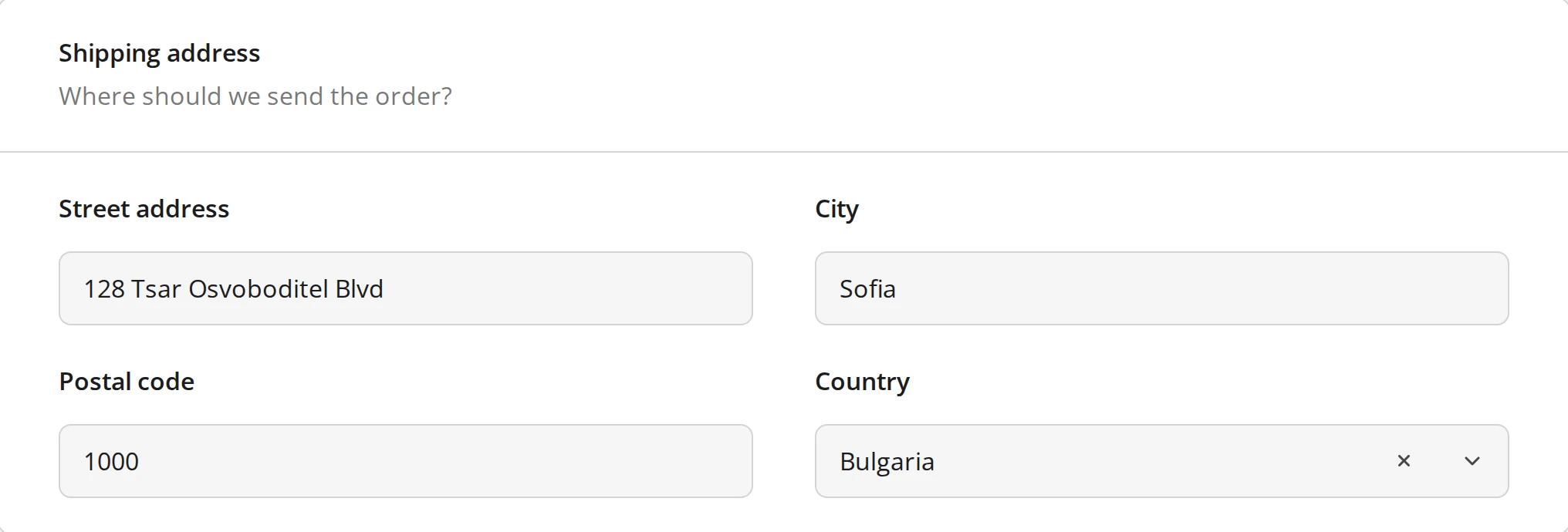 A Shipping address panel holding Street address, City, Postal code, and Country in one frame